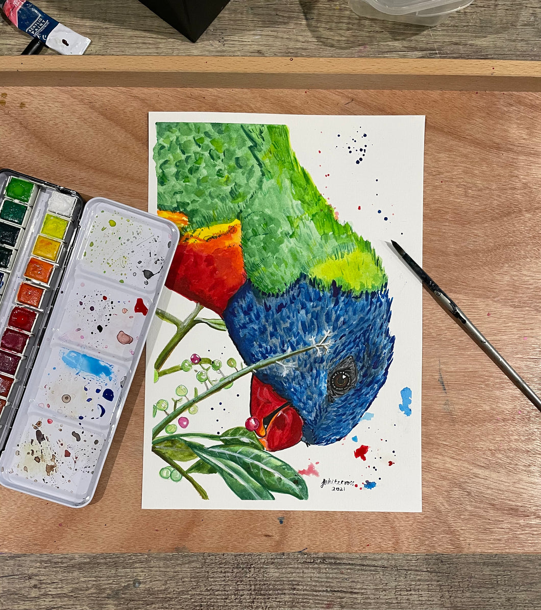 ‘Garry’ is an original watercolour painting. He is a native Australian Rainbow Lorikeet.       Lorikeets are known to be cheeky birds and ‘Garry’ definitely demonstrates this in his expression. The use of bright colours makes this a beautiful statement piece. It was painted to create happiness when you see it. Who doesn’t love a cheeky little bird. 